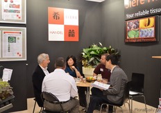 Tony Cui (on the right) of Siere Handel talking with visitors.