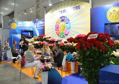 Irina Breusova of Invos Flowers talking with visitors.