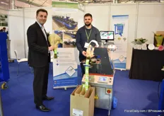 Marc Molitor and Albamn Oudayar of Mecaflor demonstrating their new binding machine with flower food dispenser. It can be directly connected to their hand-tied bouquet making machine that is already on the market. It was requested from a customer out of the US and they show it at the IPM Essen to see if there is any more interest for this product.